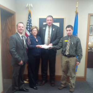 South Dakota State Representative and US Senate Candidate  Stace Nelson files over 2650 South Dakota voters' signatures with the SD Secretary of State's Office. Pictured from left to right are State Rep. Dan Kaiser, Deputy Secretary of State Patricia Miller, Stace Nelson, and Drew Dennert